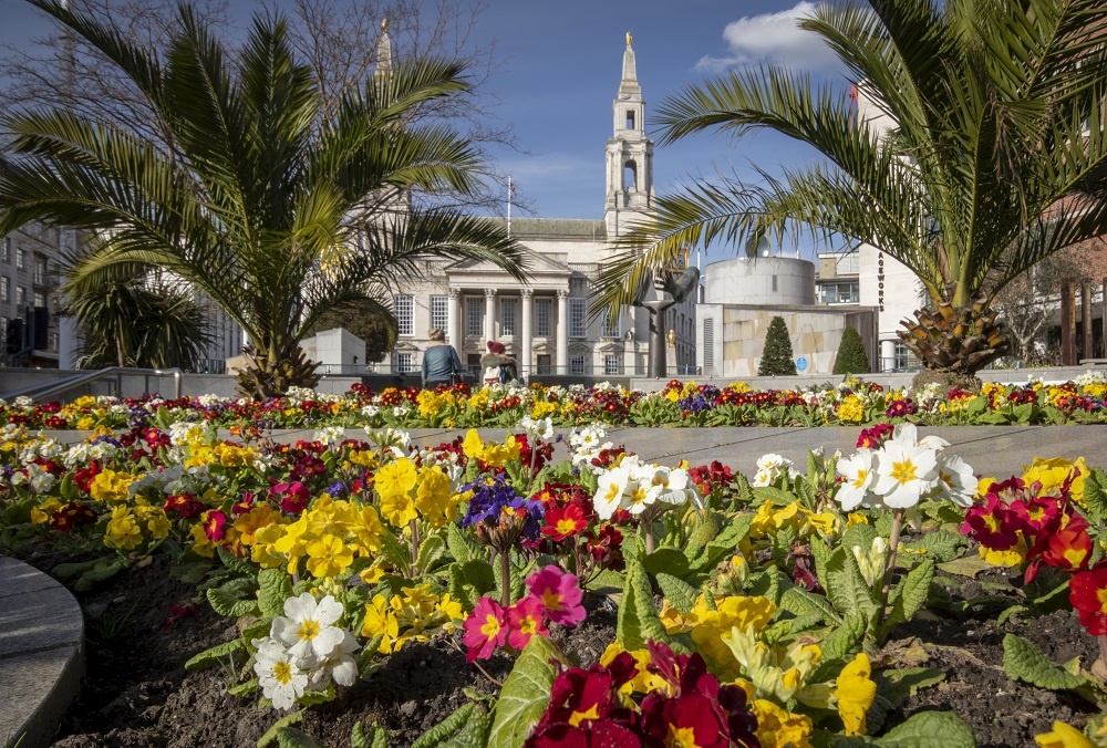 Colourful flowers in the foreground, Leeds Civic Hall in the background