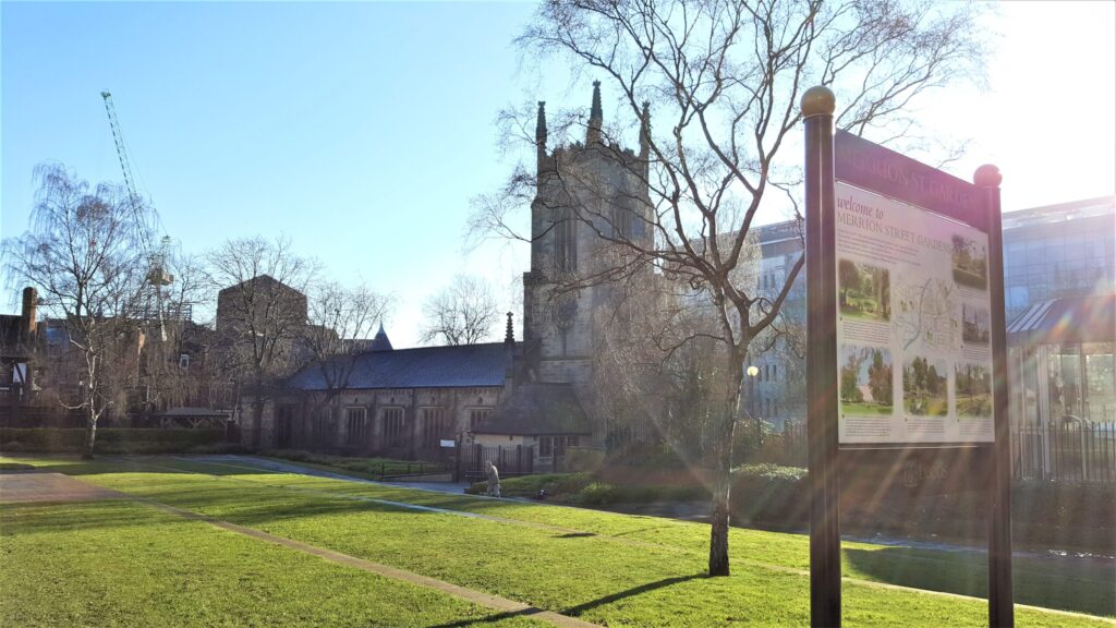 View of St John the Evangelist’s Church leeds in Merrion Gardens on a sunny day