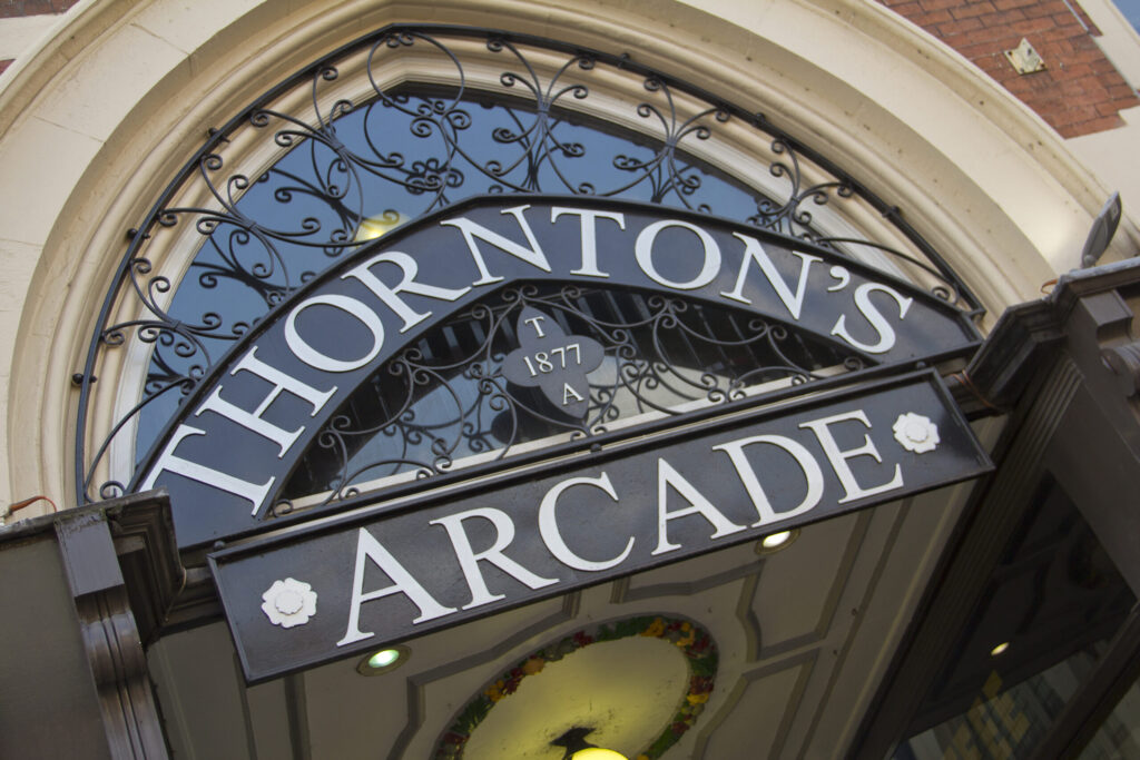 An ornate sign reading 'Thornton's Arcade'