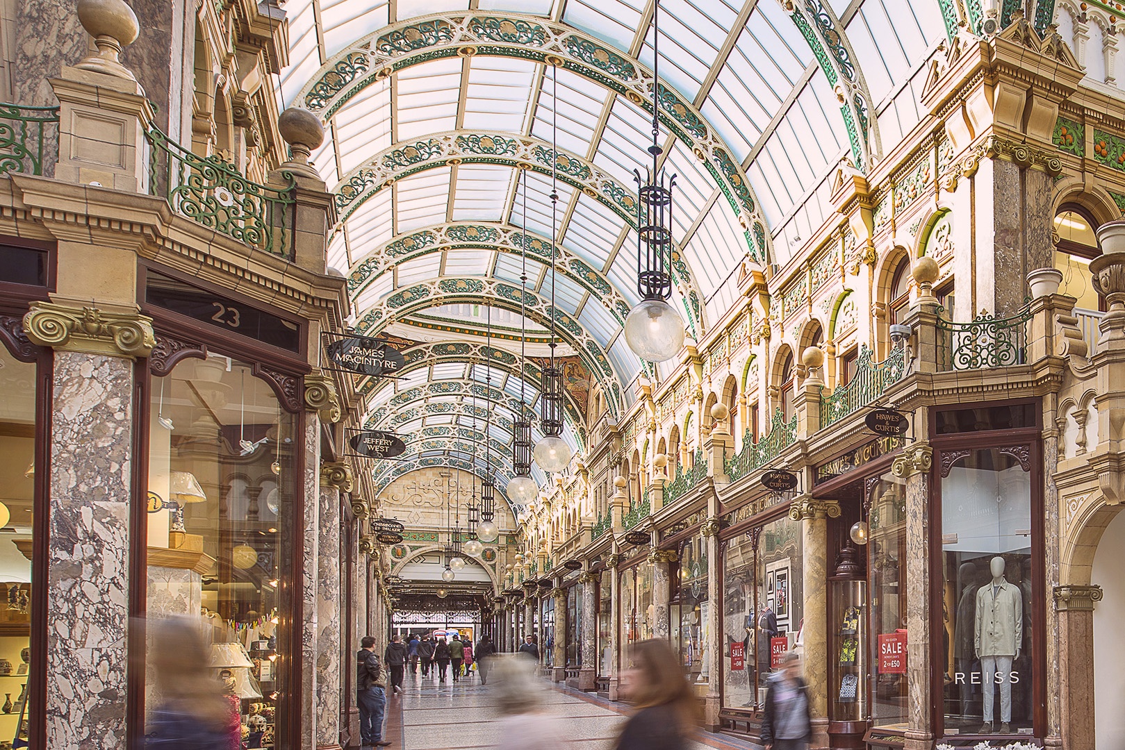 Interior view of Victoria Arcade in Leeds showing beautiful ornate architecture and glass ceiling