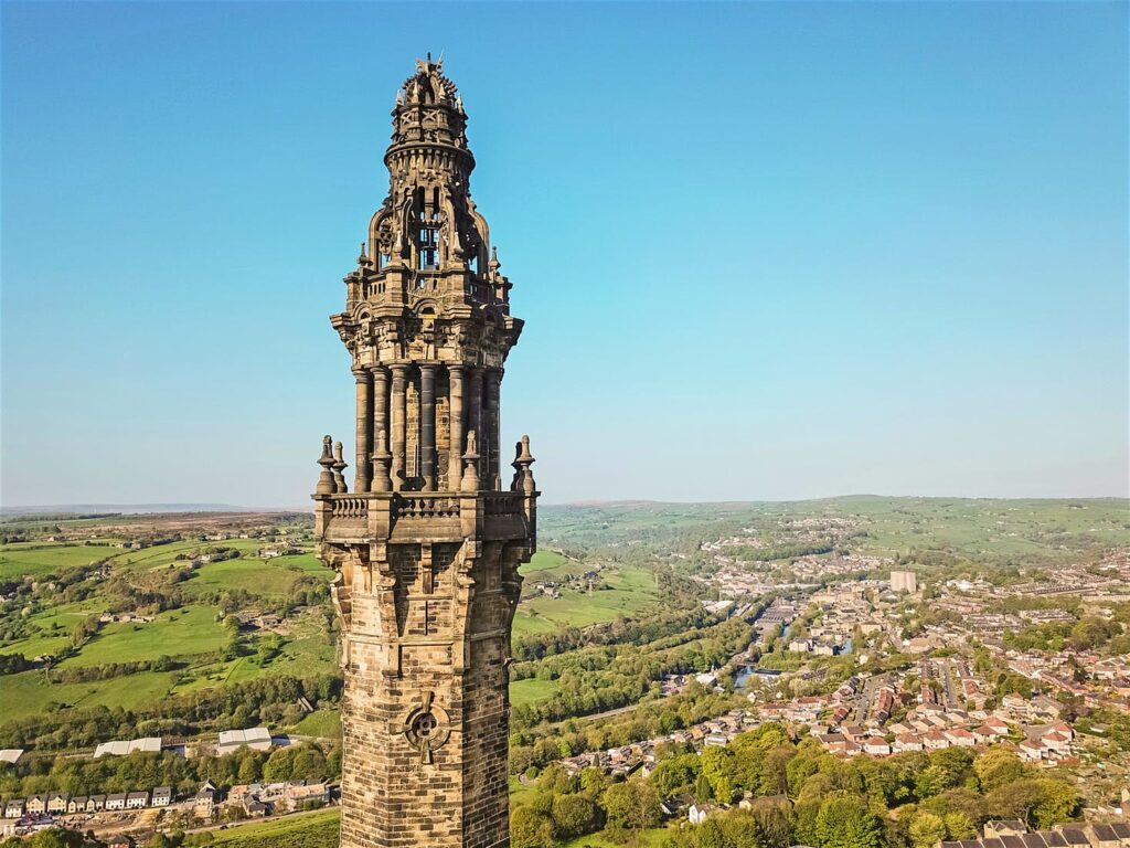 View of the historic Wainhouse Tower in front of a blue sky