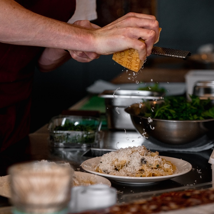 Chef preparing a pasta dish at Sarto - Amy Heycock for Visit Leeds