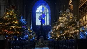 a church decorated with christmas trees