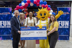 a group of people, one in a sun costume