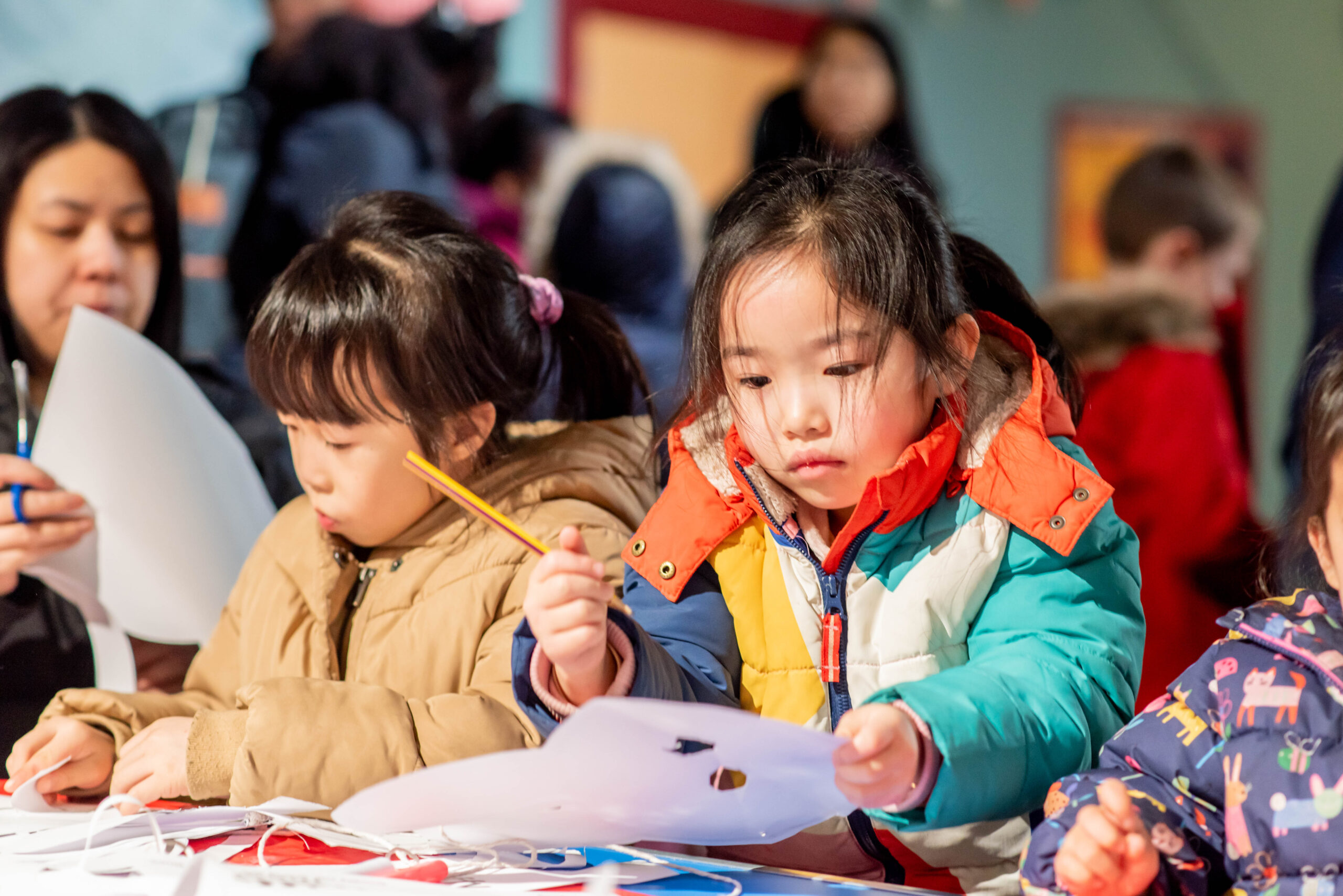 Two children enjoying crafts at Leeds City Museum