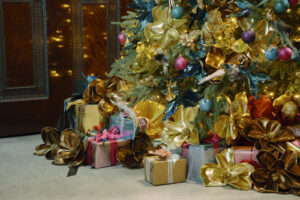 a group of presents and other decorations underneath a christmas tree