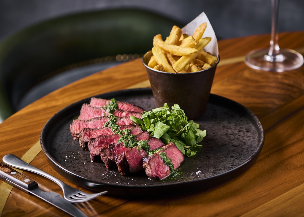 a plate of steak and fries