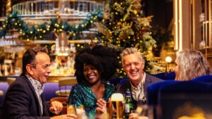 couples enjoying a fine dining experience with christmas decorations