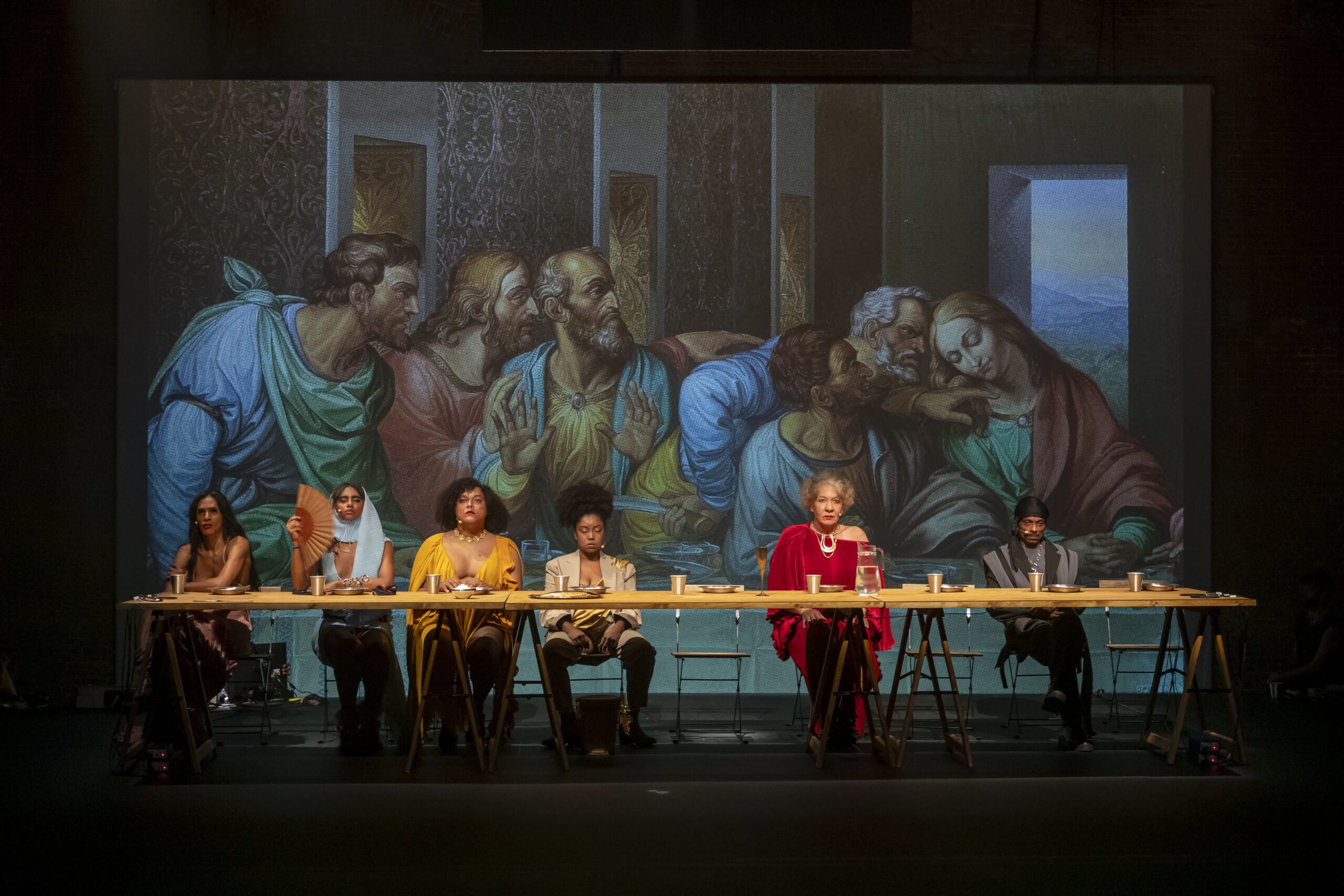 a group of people sat at a long dining table