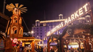 A windmill and 'Leeds Christmas Market' sign in lights