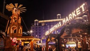 A windmill and 'Leeds Christmas Market' sign in lights