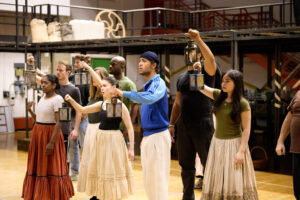 a cast of actors in a rehearsal 