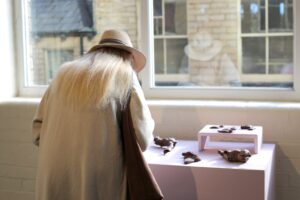 a person looking at a display on a table of objects