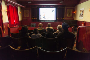 a group of people in a small cinema