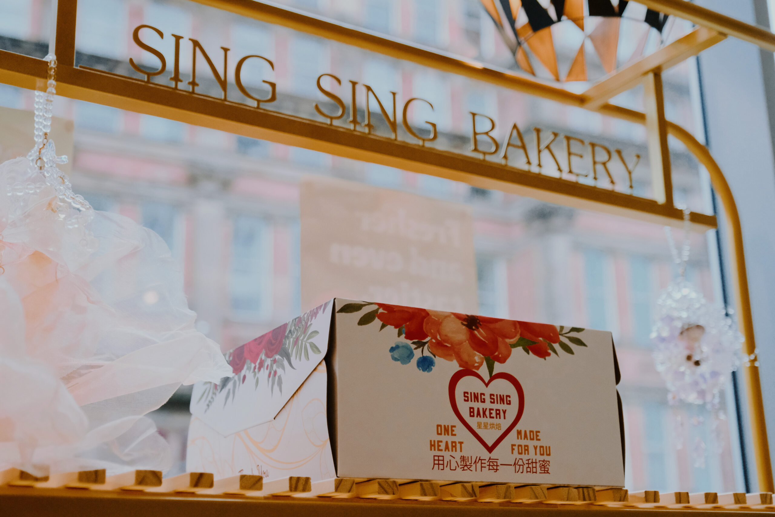 a box of baked goods on a bakery table