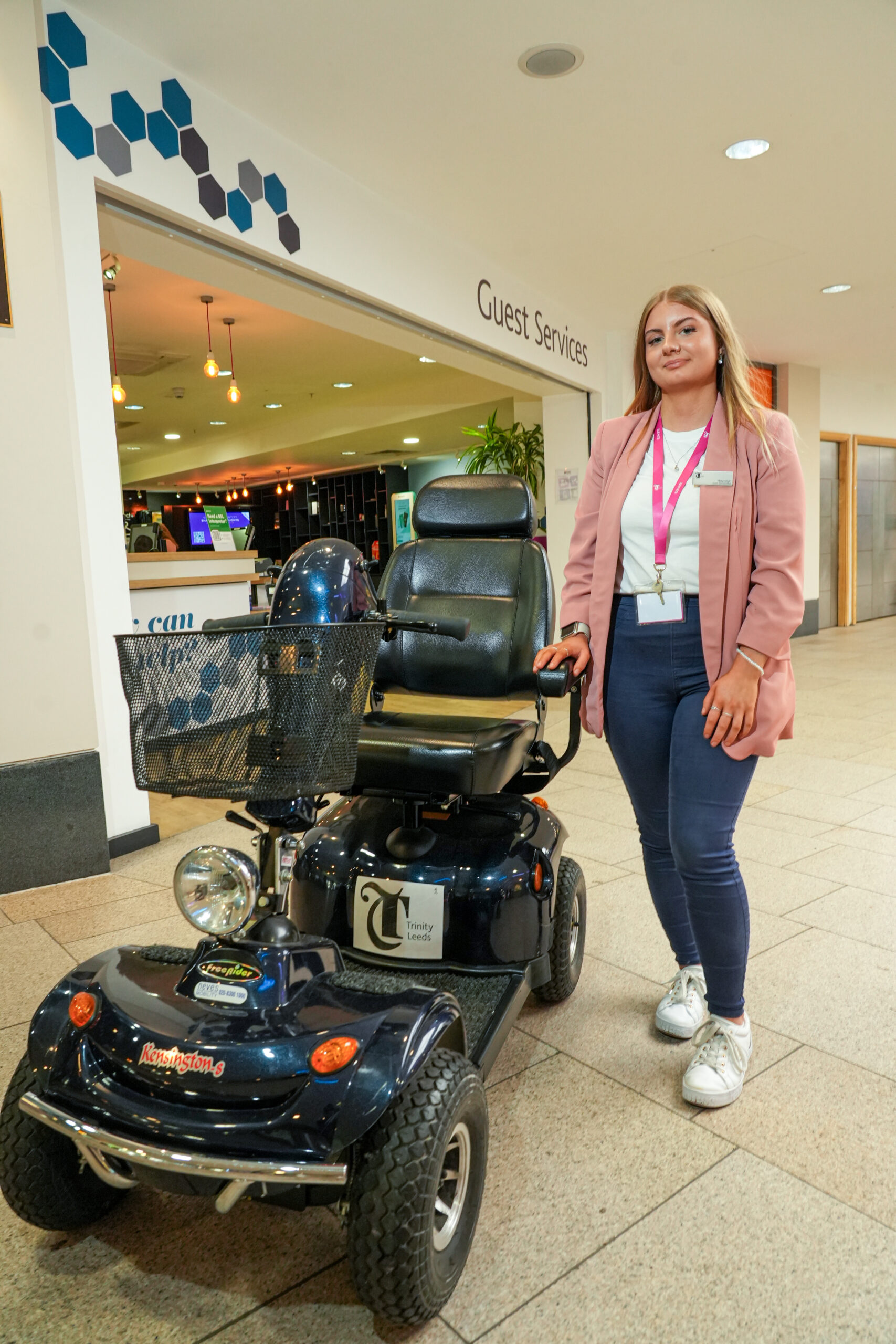 a person stood next to a mobility scooter