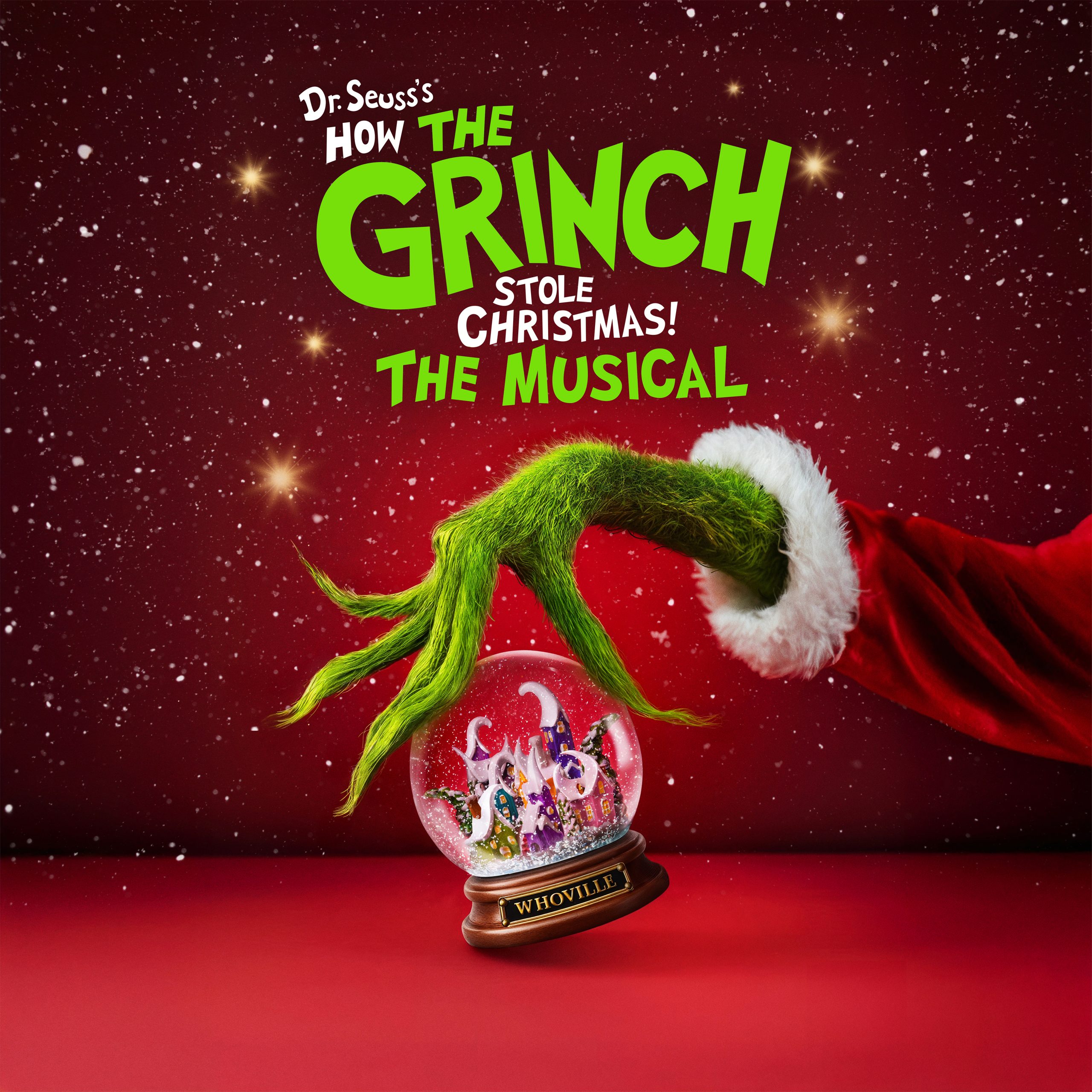 a poster with text saying Dr Seuss's How The Grinch Stole Christmas The Musical, with a green furry hand reaching for a snowglobe underneath the text