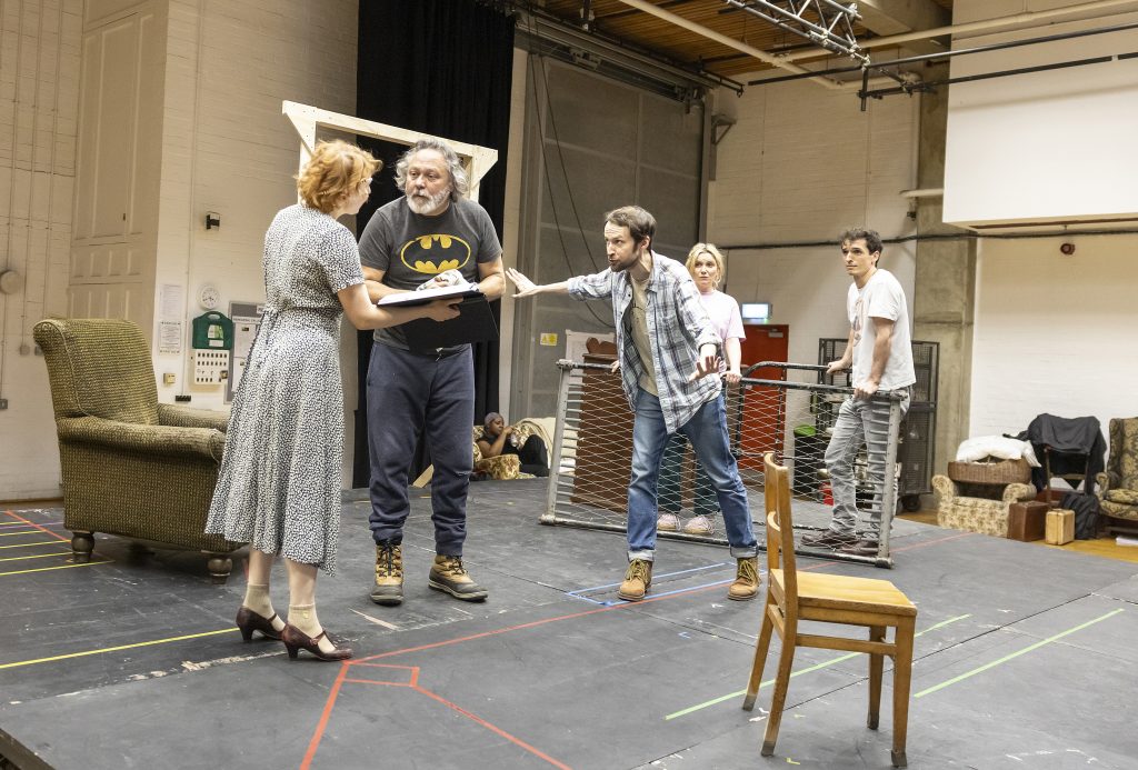 a group of actors at a theatre rehearsal