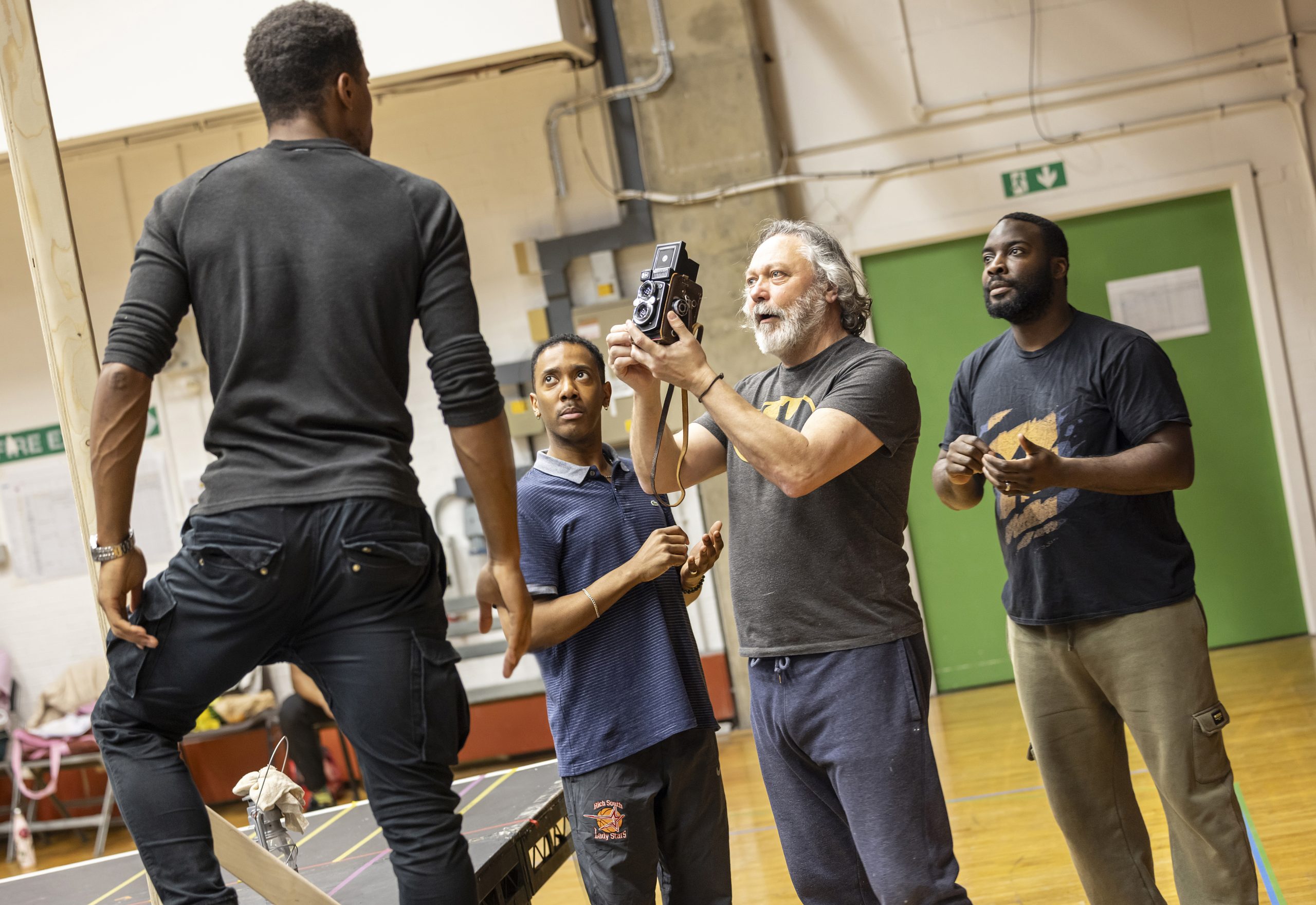 a group of actors in a rehearsal