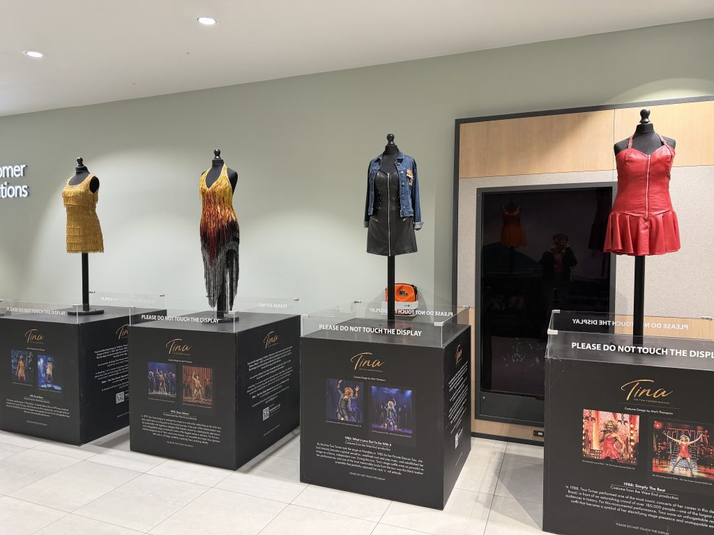several costumes on display on mannequins