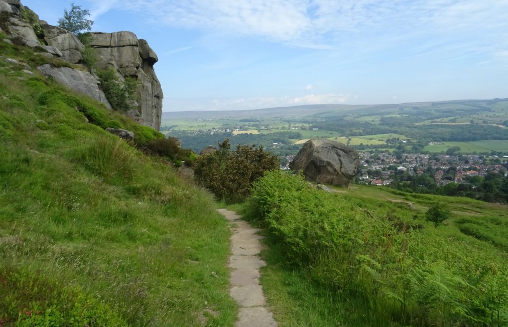 a large outdoor nature space with moorland, and large rocks