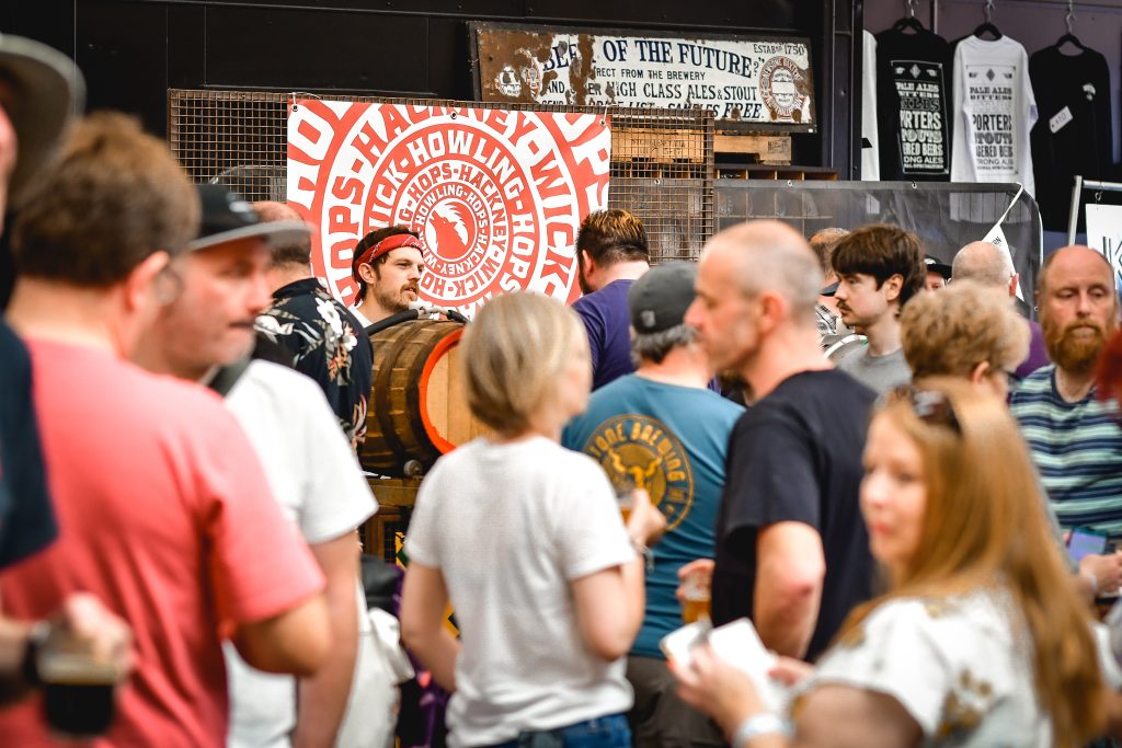 a crowd of people in an outdoor event on a sunny day