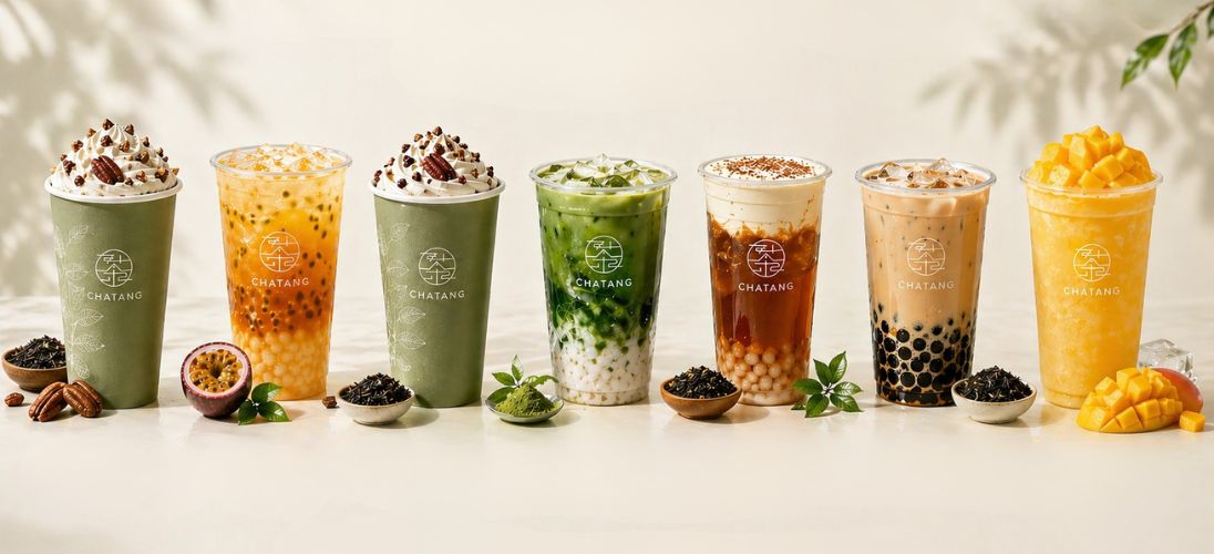 a lineup of different drinks in clear cups