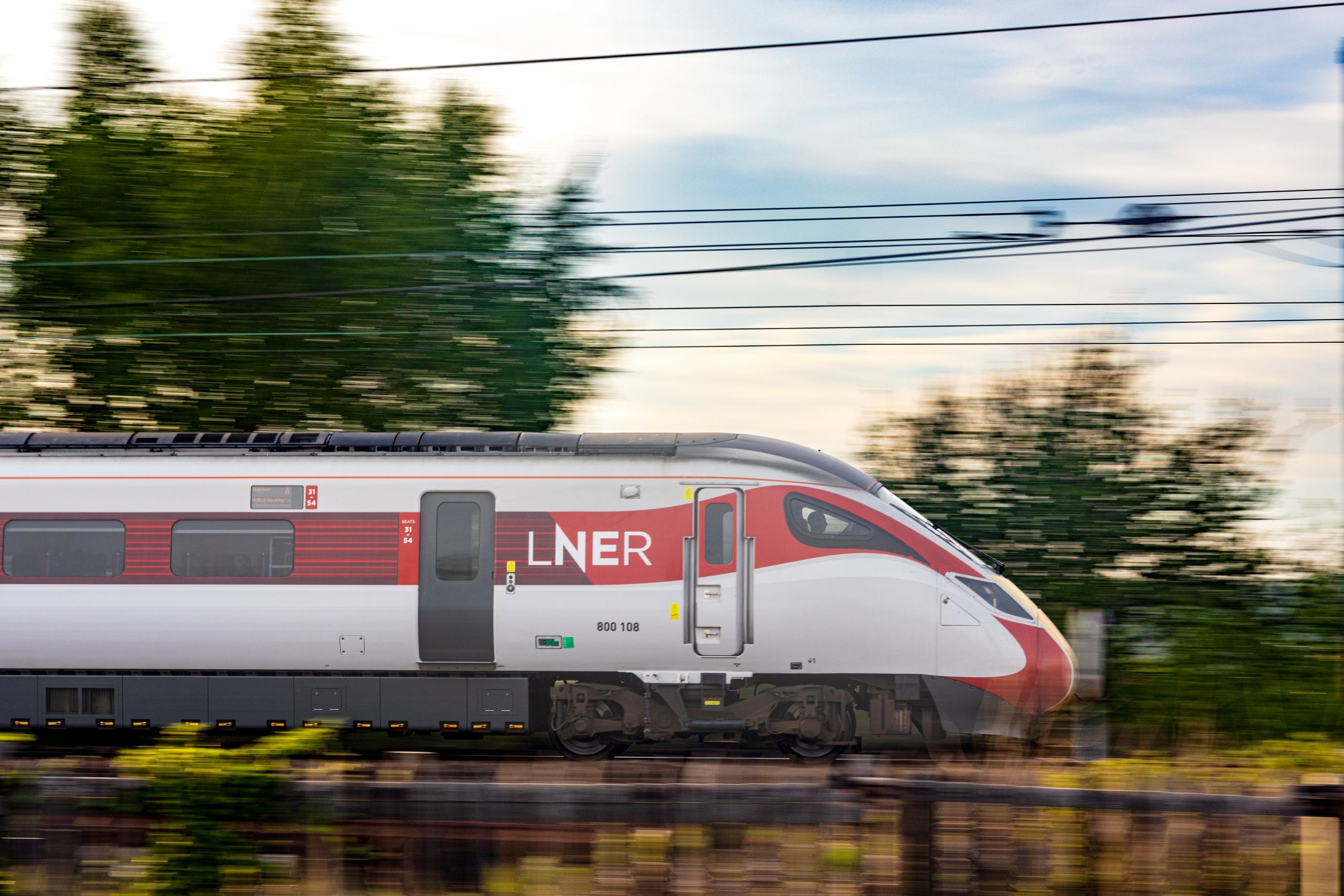 LNER train high speed through landscape