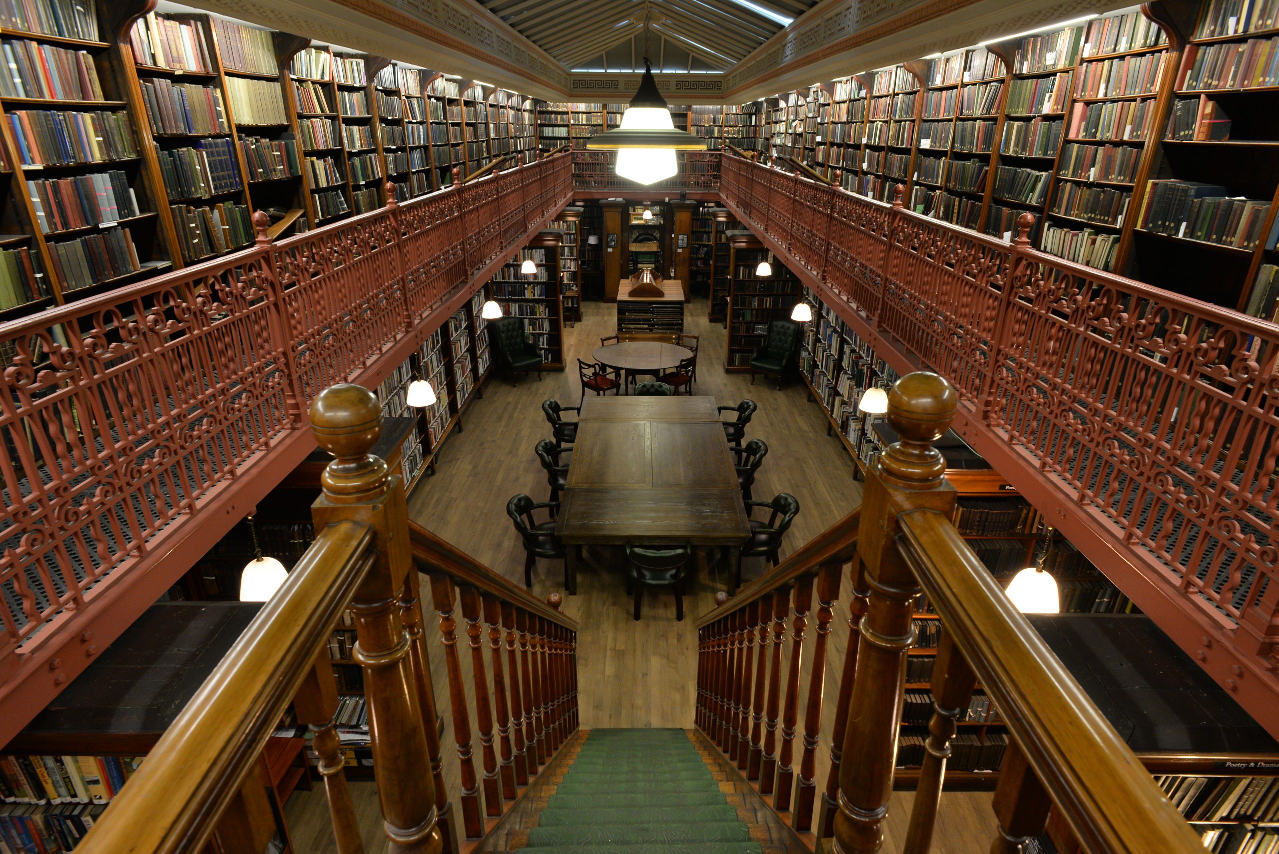 Interior view of the Leeds Library from the upper floor balcony