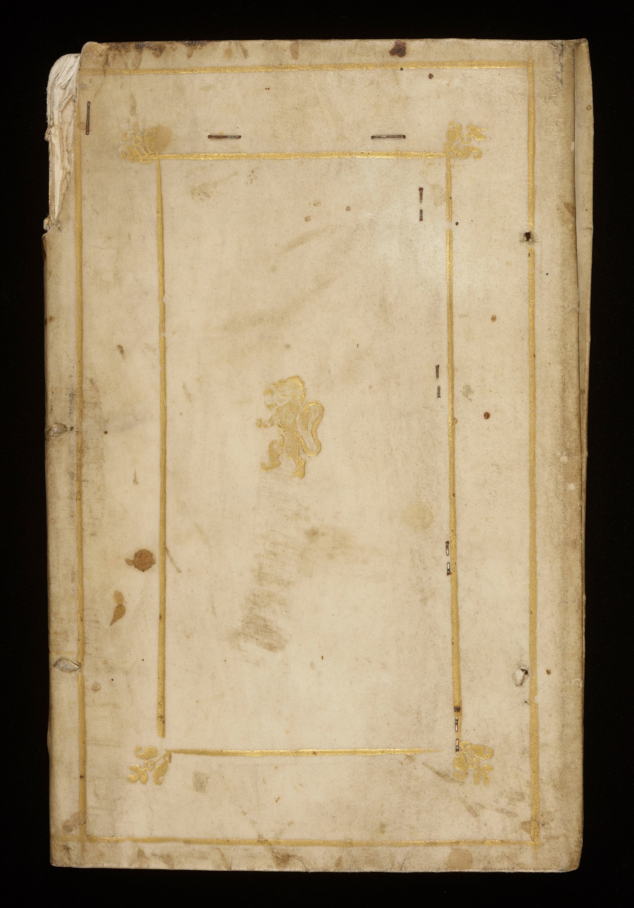 the front cover of a very old weathered white book