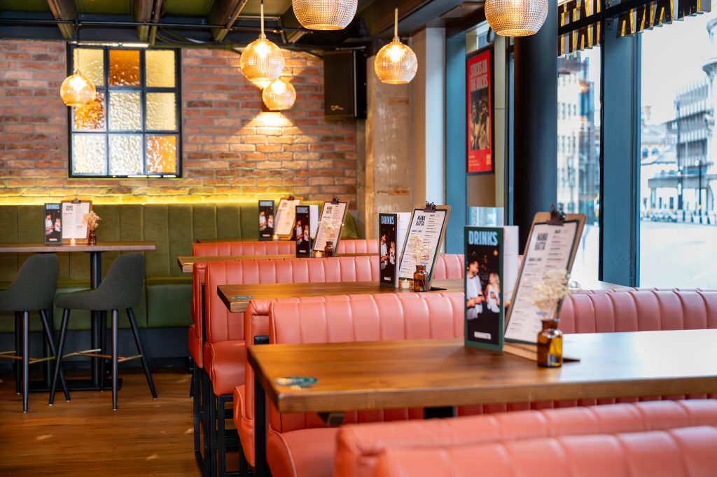 booth seating at an indoor restaurant by a window